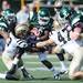 Eastern Michigan sophomore Dominique White gets caught up by Western Michigan sophomore Demetrius Pettway and senior Mitch Zajac during the first half against Western Michigan at Rynearson Stadium on Saturday afternoon. Melanie Maxwell I AnnArbor.com